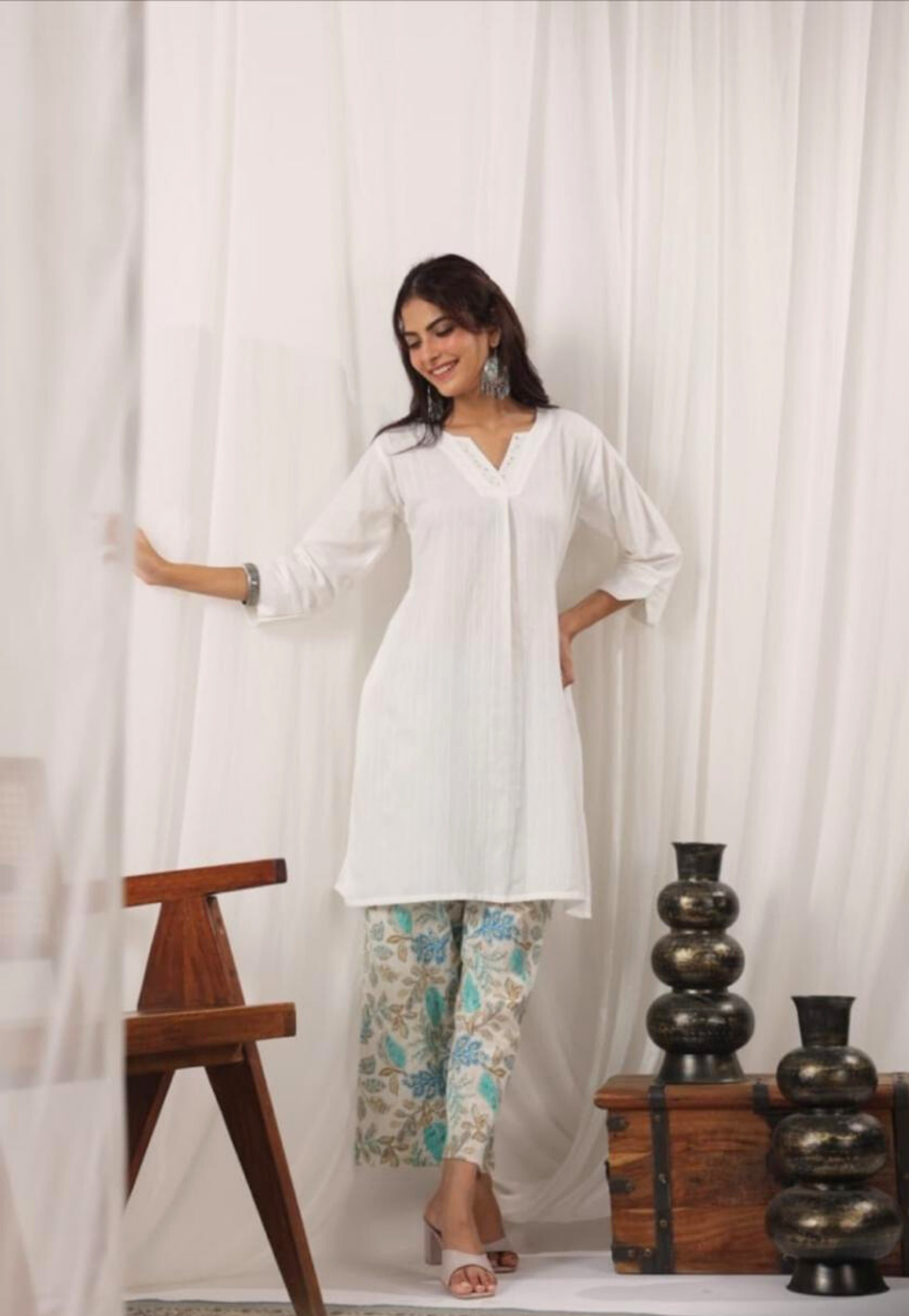 White cotton self printed kurti top with cotton floral pants