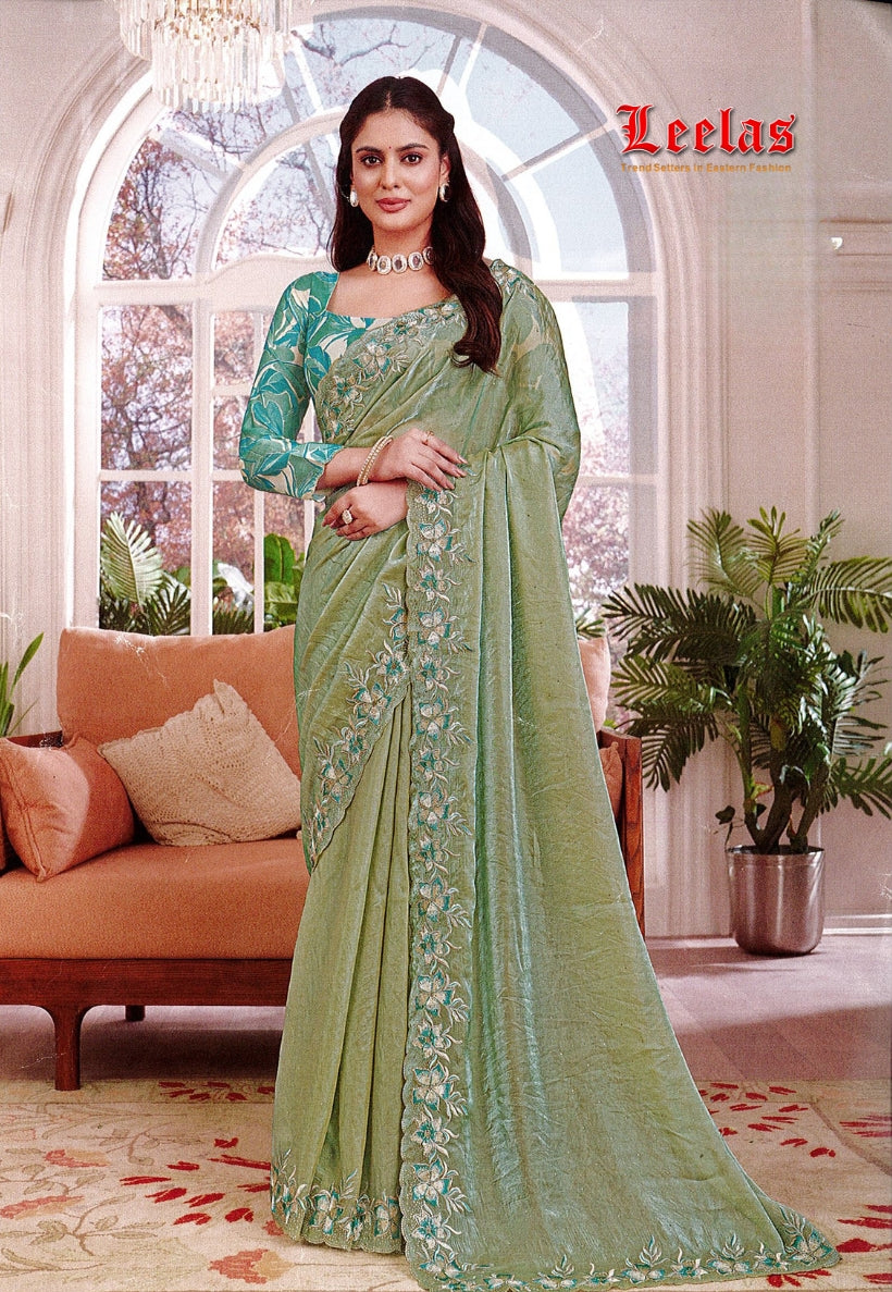 Green art silk saree, embroidered border with contrasting blouse piece