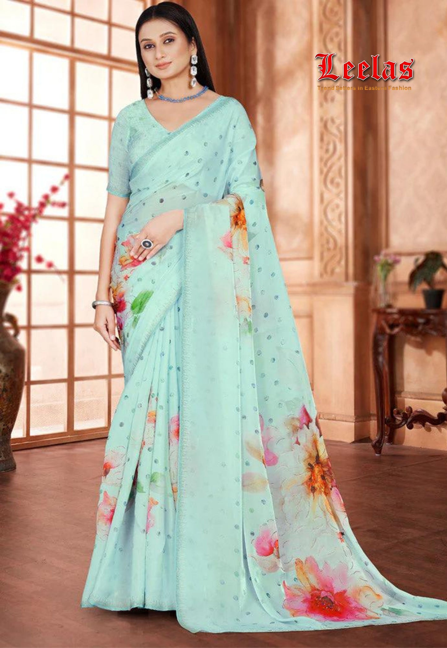 Sea green polka dot and floral saree