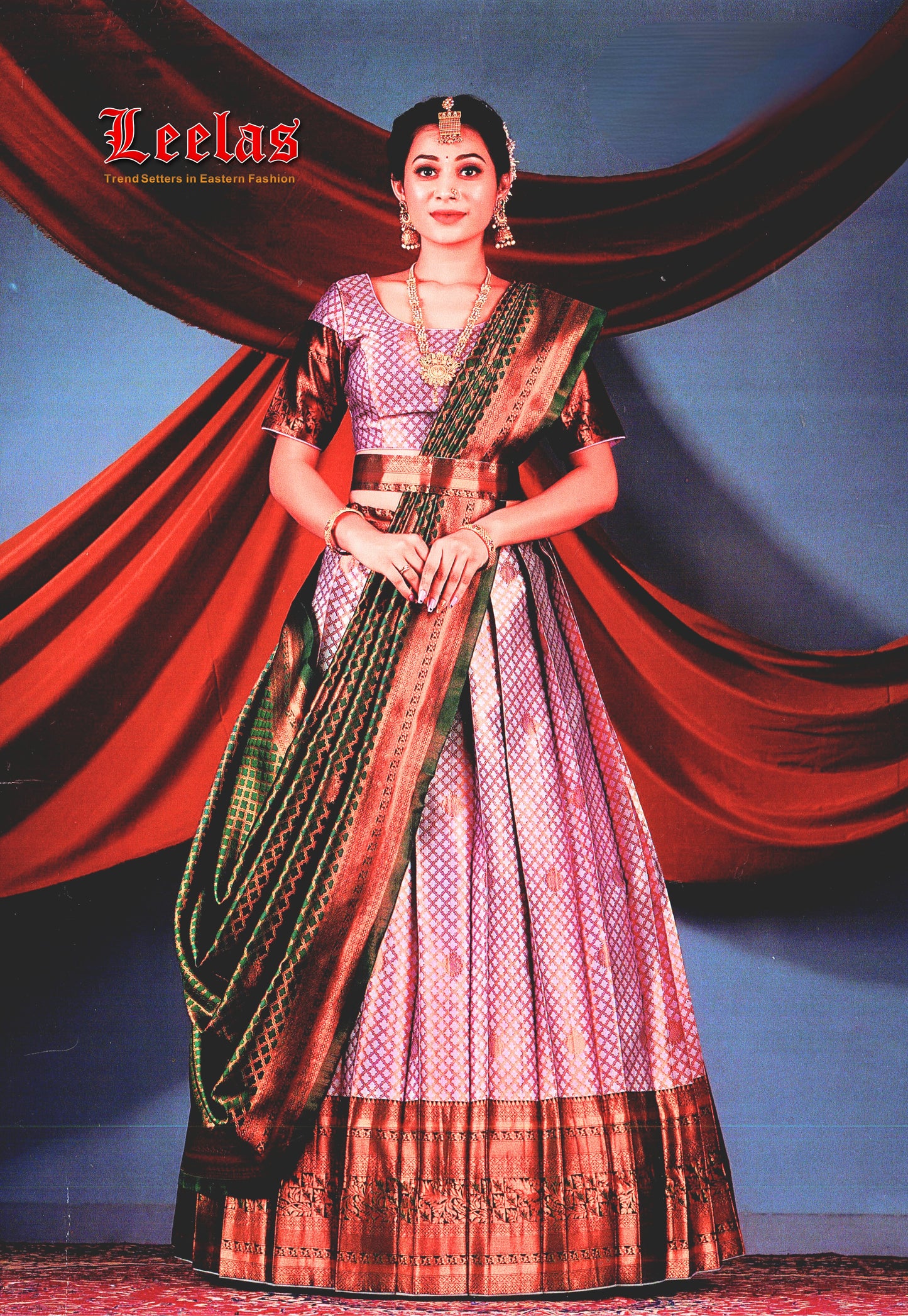 Silk lilac, and bottle green lengha with bronze embossed border