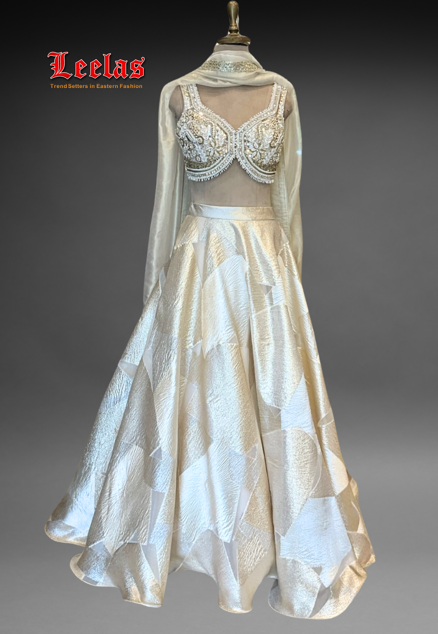 Blend of satin and silk cream and gold lehengha, with fully worked ready made blouse