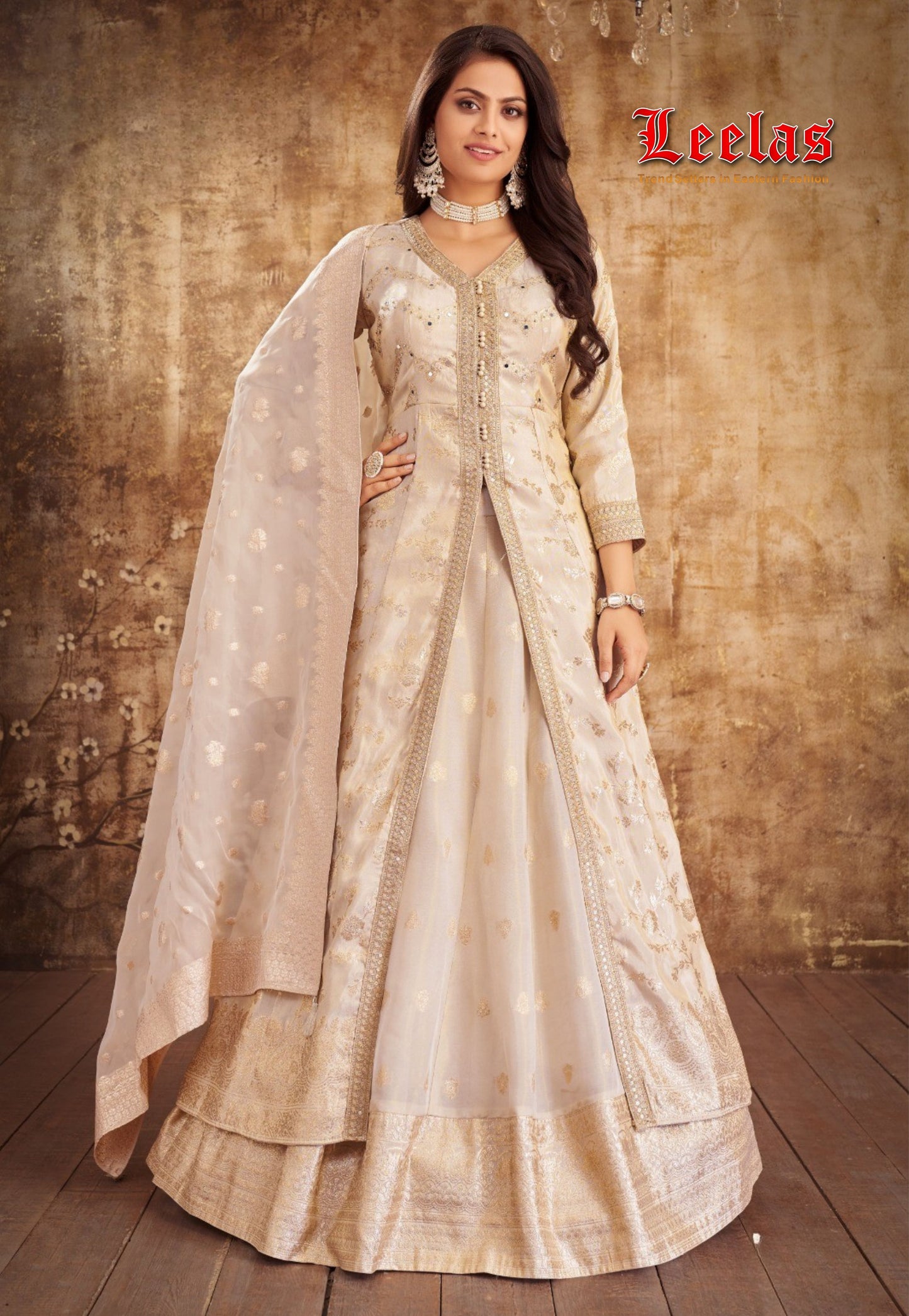 Cream and gold lehenga with mirror and stonework and matching dupatta
