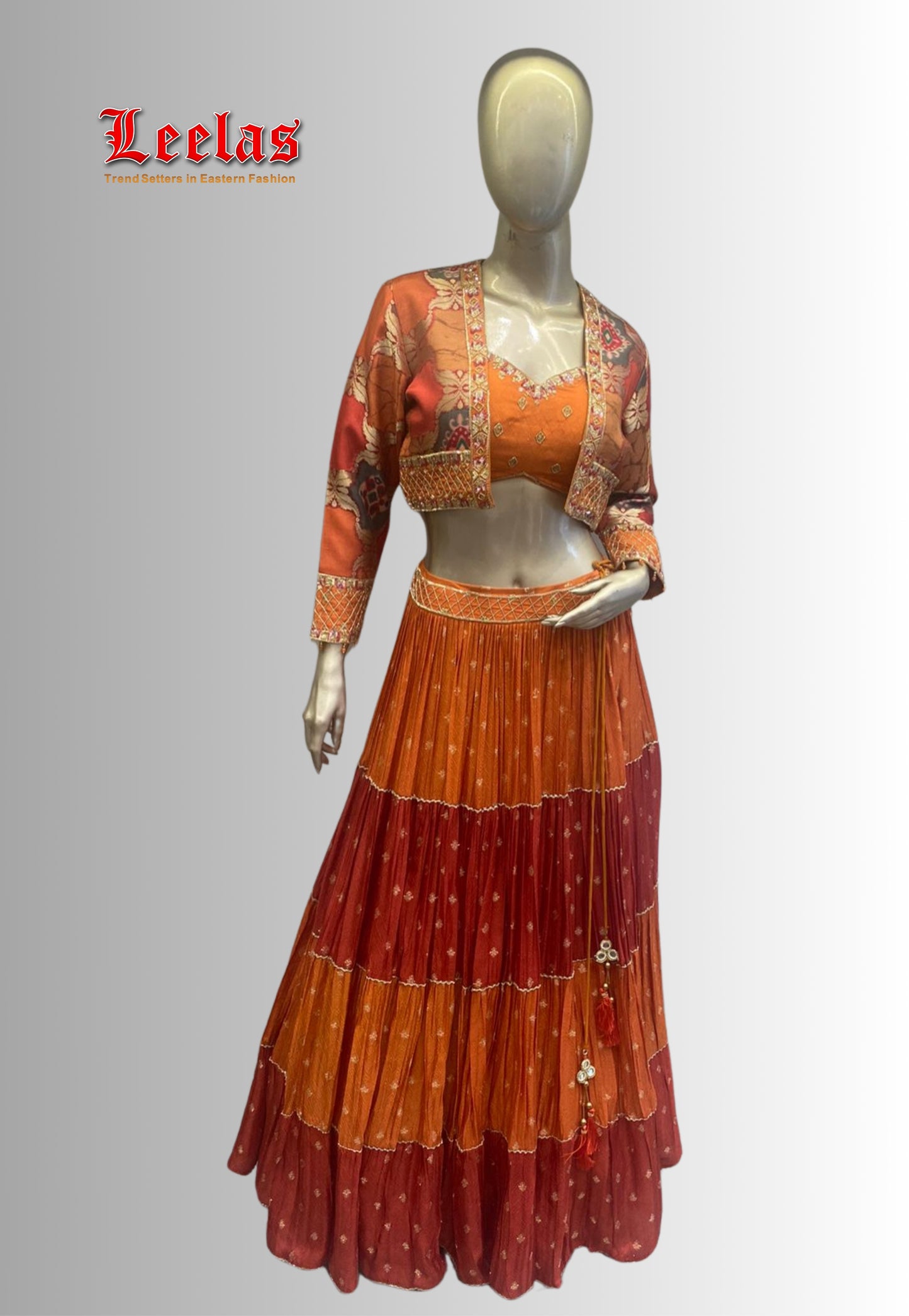 Burnt orange and rust silk lengha with ready made blouse with gold sequins and beadwork