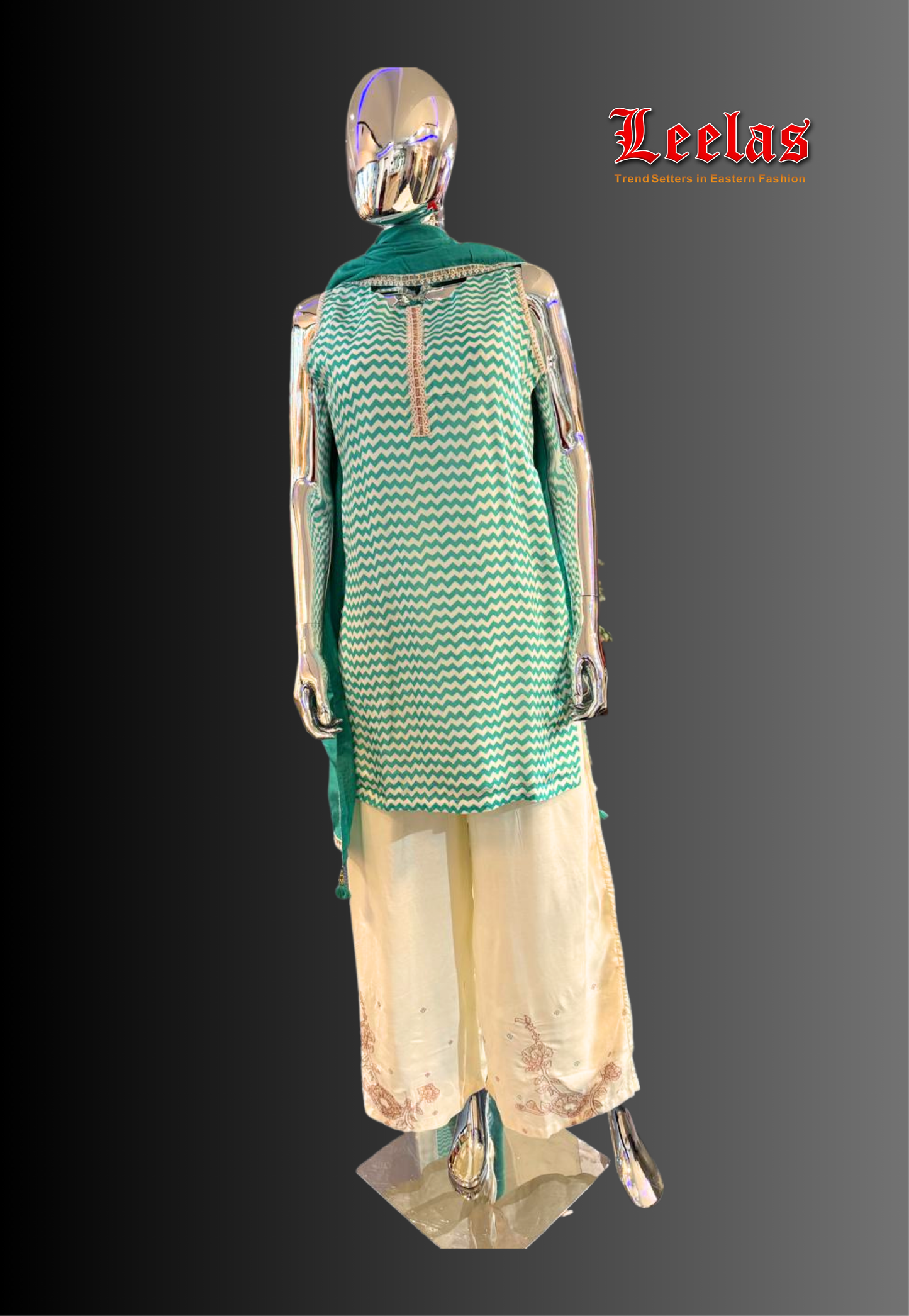 Turqoise and white cotton silk salwar kameez with embroidery detail on neckline and pants