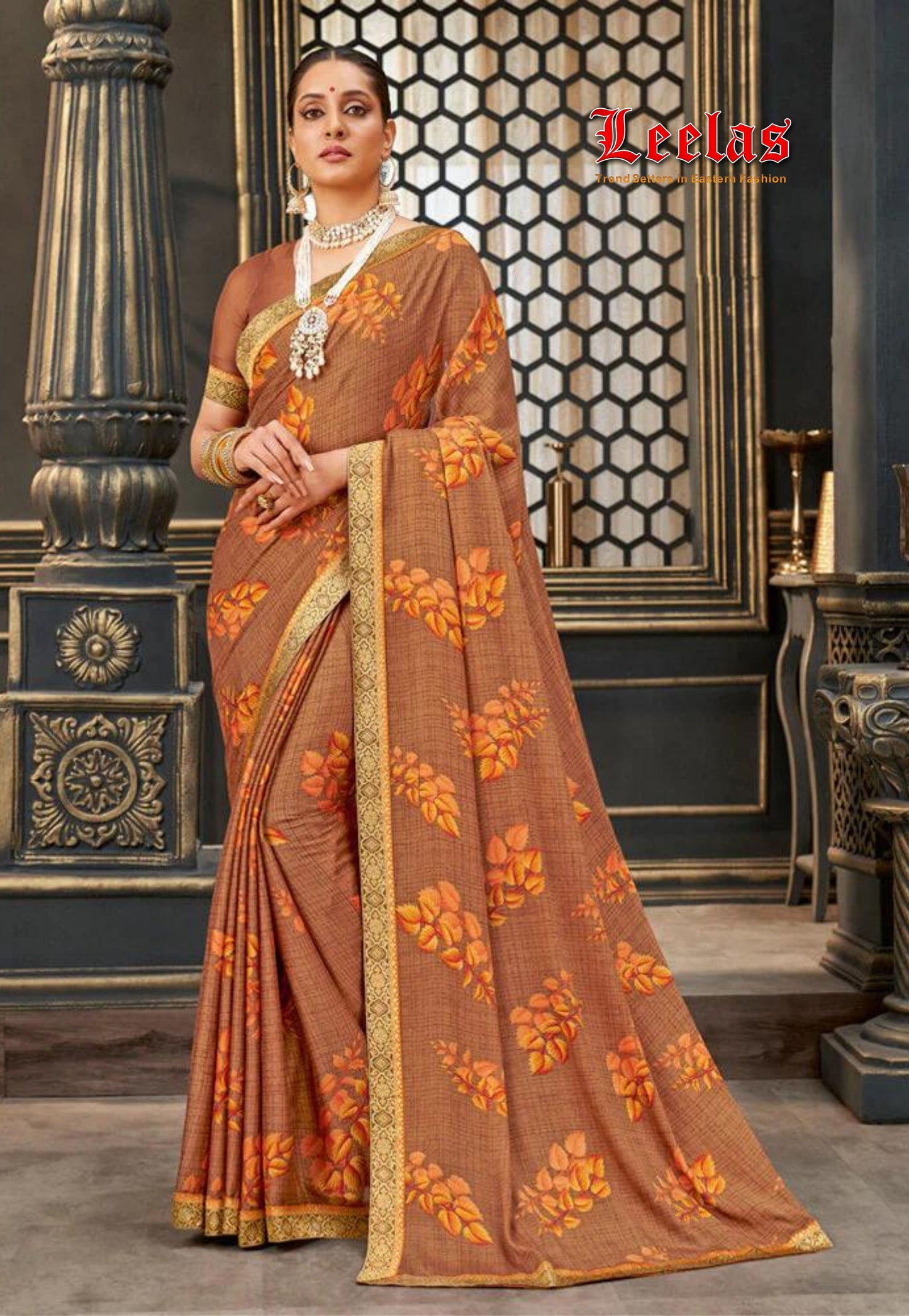 Tan and orange floral printed crepe silk saree