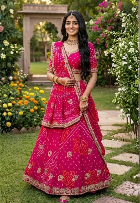 Pure georgette bandhani unstitched lengha with vibrant rani pink tie dye patterns, embellished with gota patti and embroidery