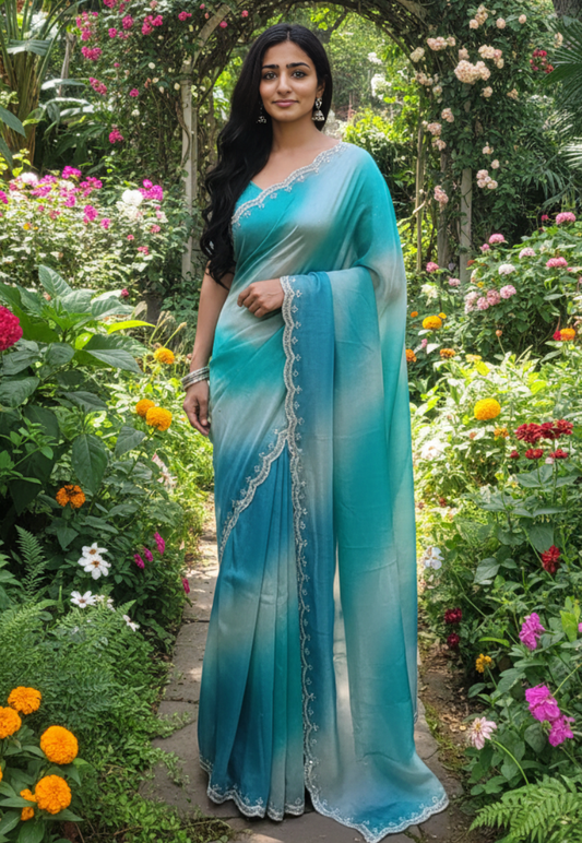 Teal and grey ombre tissue silk saree with a delicate scalloped stonework border