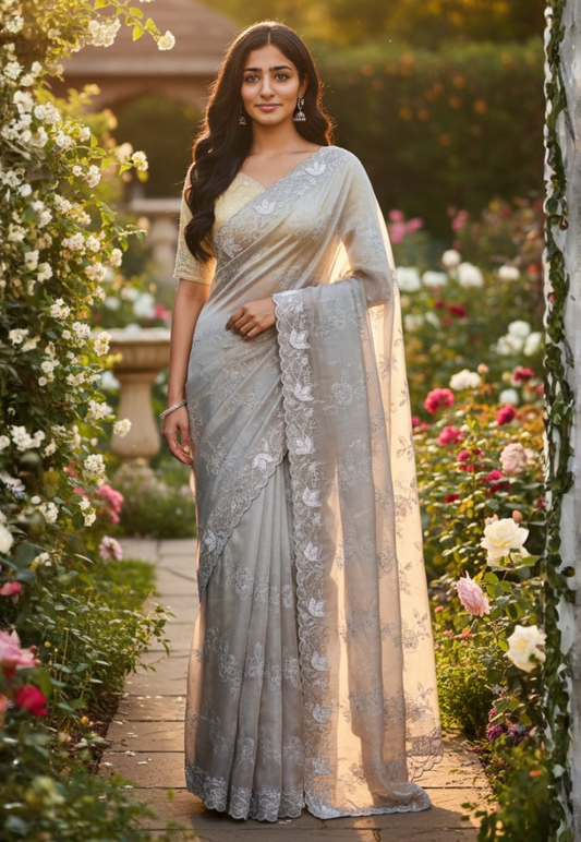 Grey tone sheer organza saree with silver floral embroidery and sequins with scalloped stonework border