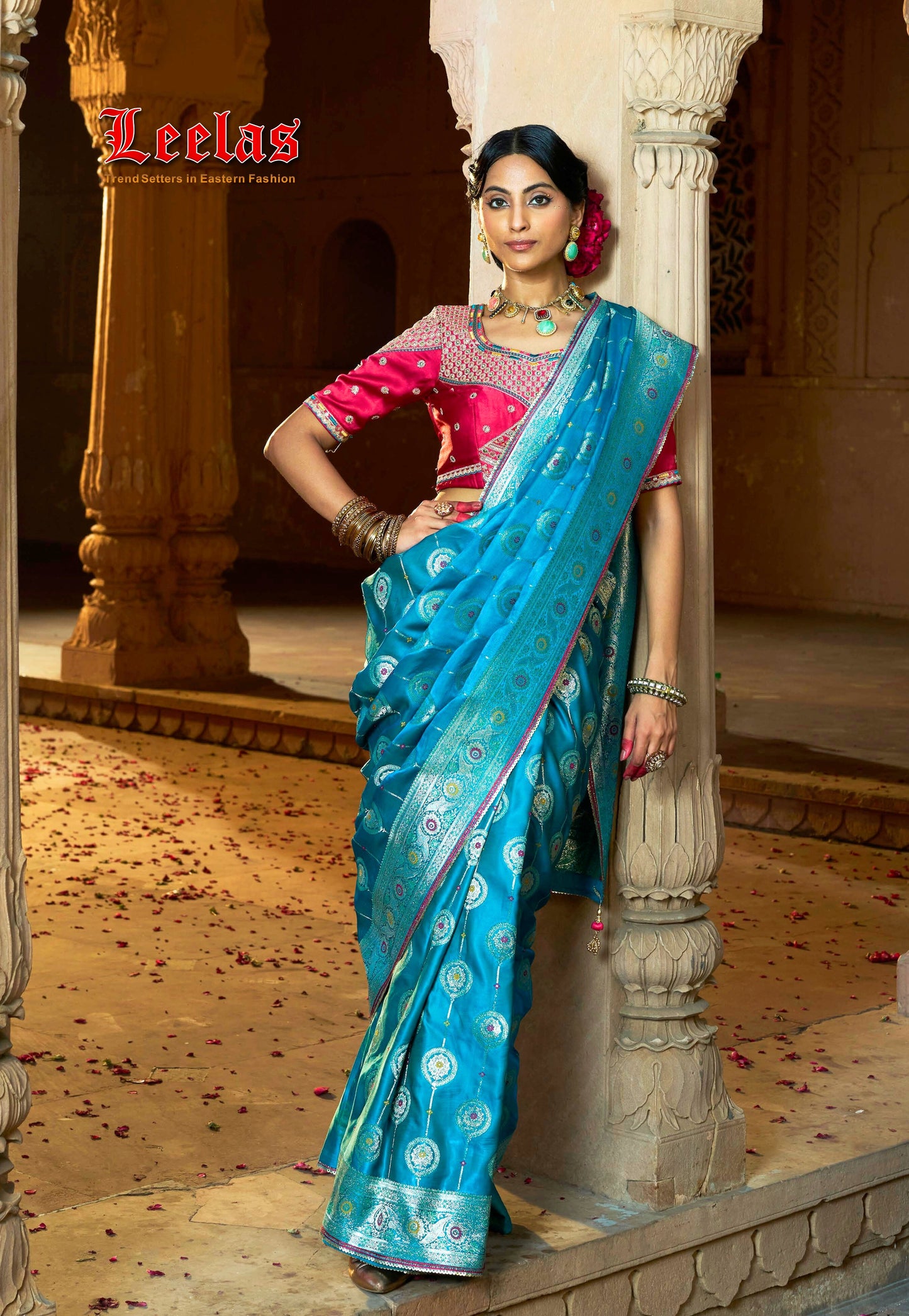 Turquiose satin saree with gold embossed detail and contrasting cerise pink blouse, Indian Wear Johannesburg