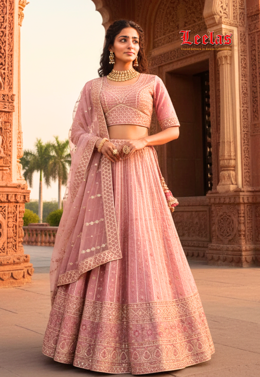 Mink malai silk lengha choli adorned with intricate embroidery with zari and mirror work