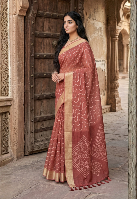 Intricate wave and geometric silk blend patterned saree in tones of rust and terracotta with bandhani inspired pattern on pallu