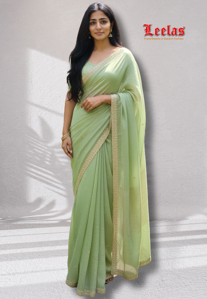 Mint green and gold tissue silk saree with mirror and bead work border.