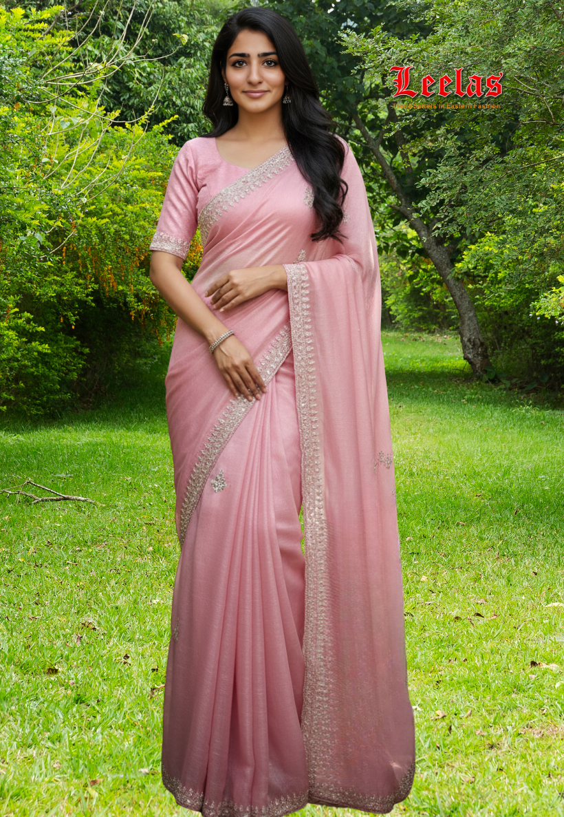 Mink shimmer silk saree with beaded stone work and sequins silver border.