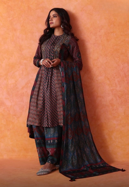 Multi patterned detailed ethnic Salwar Kameez in deep earthy  tones