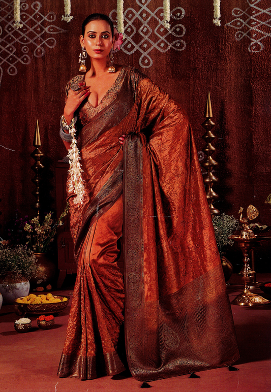 Warm bronze silk blend saree with light embroidery and paisley border