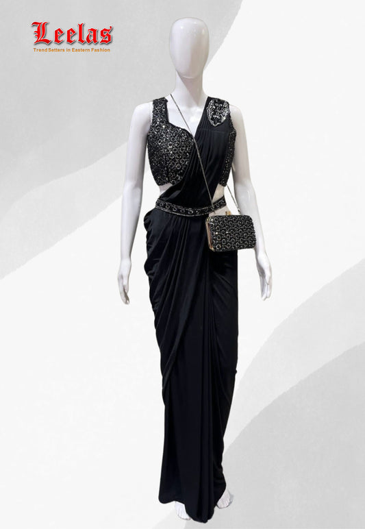 Black silk ready stitched saree with full black beaded and sequin sleeveless ready made blouse, with unstitched sleeves with matching saree belt and hand bag