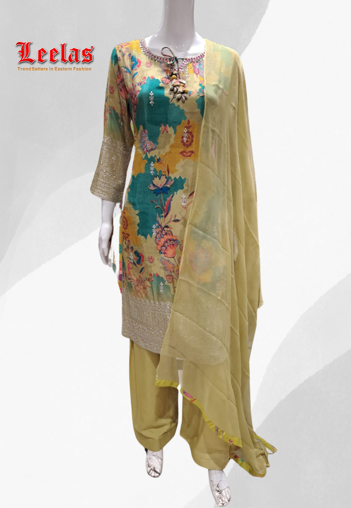 Olive green and blue floral printed silk salwar kameez with sequin and bead work on neckine
