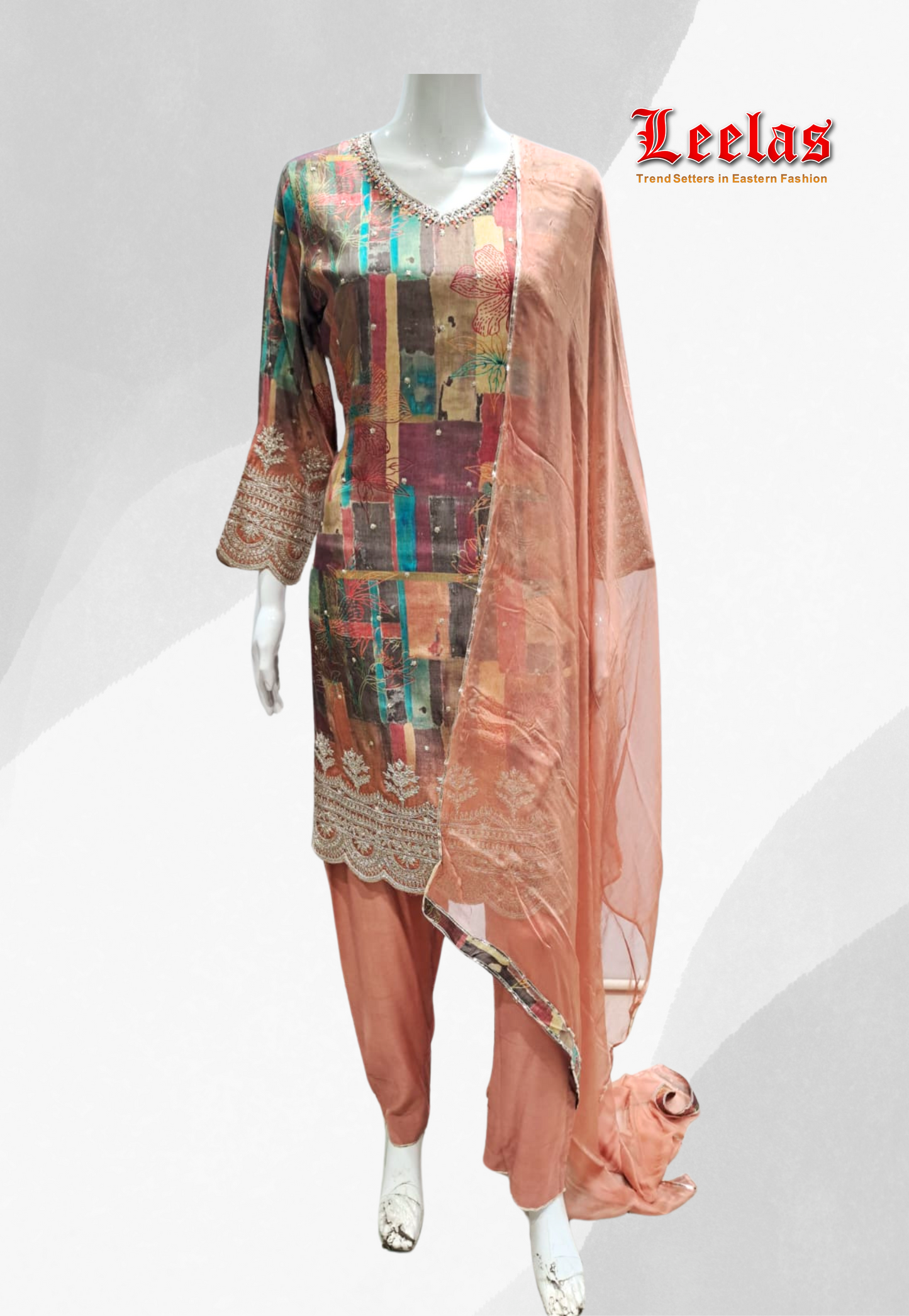 Peach and brown floral printed silk salwar kameez with sequin and bead work on neckine