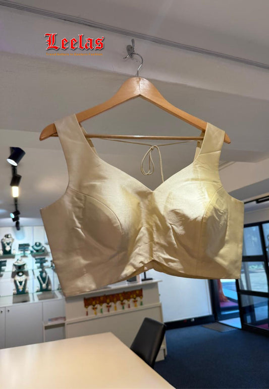 Cream silk ready made sleeveless blouse
