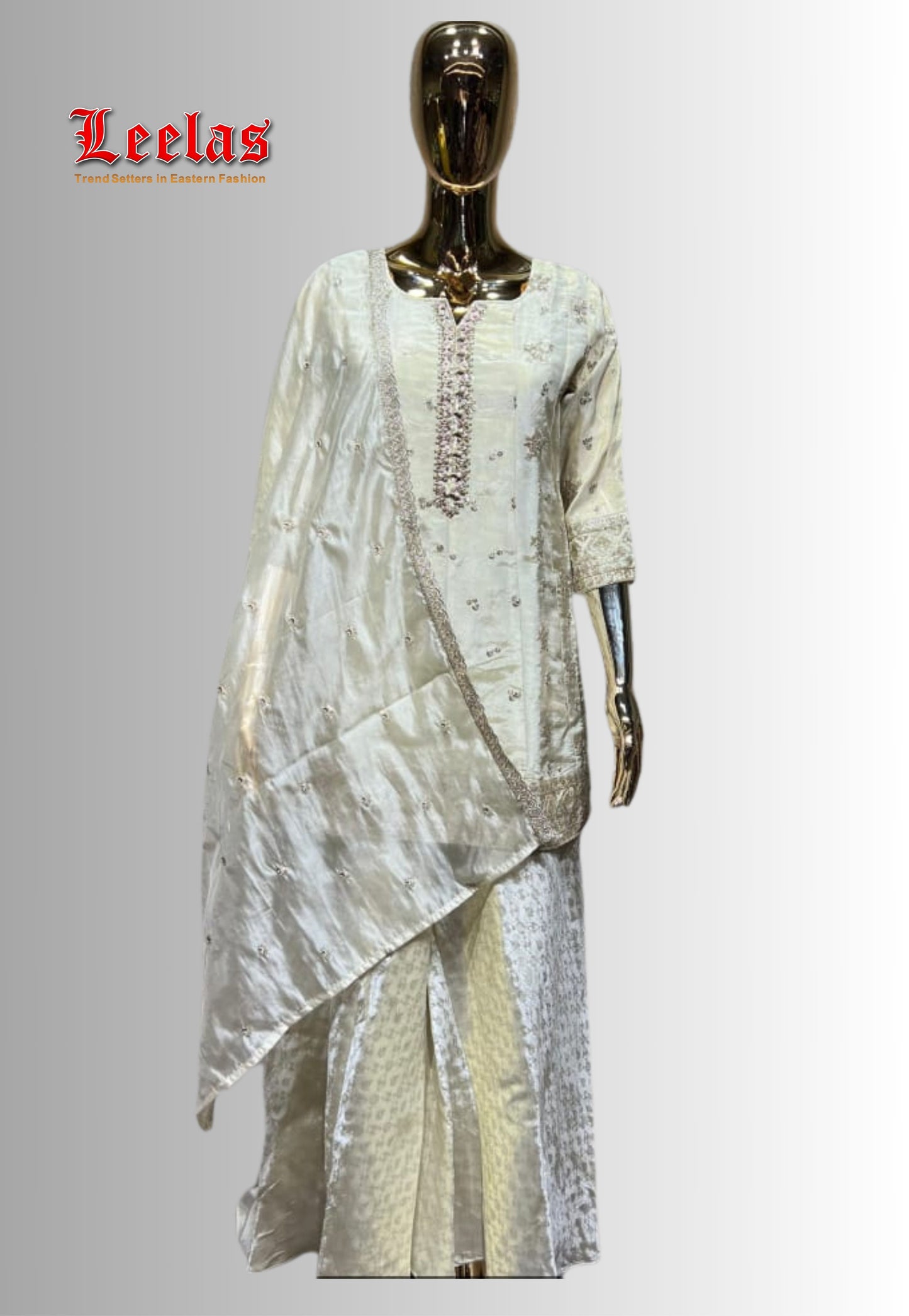 Cream and gold silk salwar kameez with embroidery and sequin work and matching gold and cream dupatta