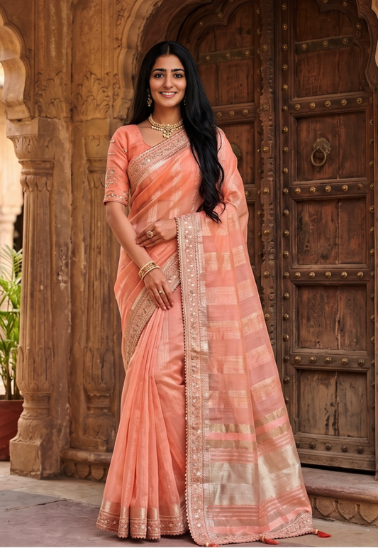 Light peach cotton silk saree with sequins and zari border and matching blouse piece