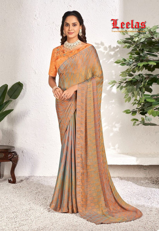 Rust and grey contrasting georgette saree with stonework