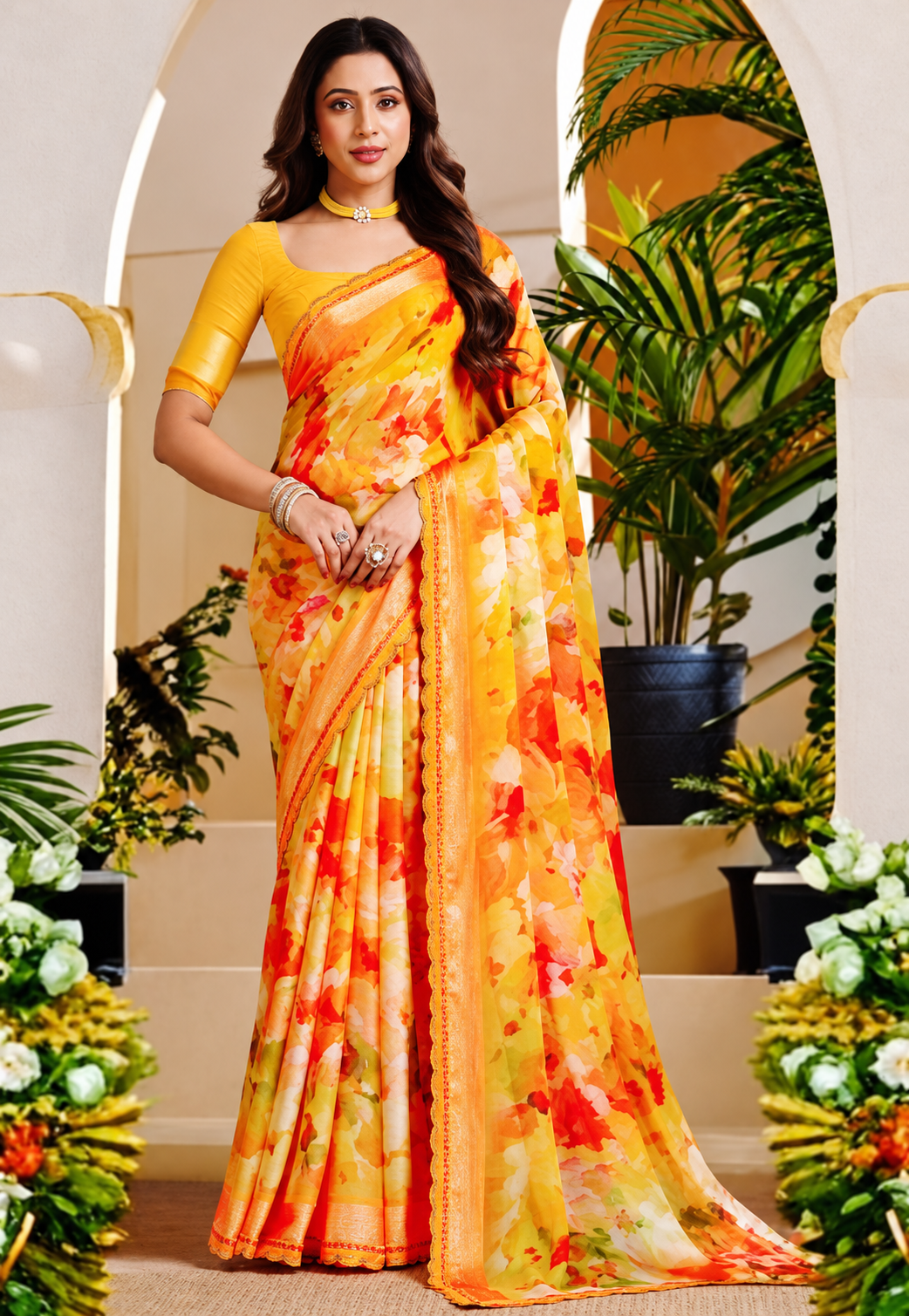 Floral saree in bright yellow, orange and olive tones with stonework