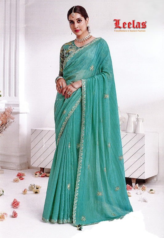 Light teal art silk saree, embroidered border with contrasting blouse piece