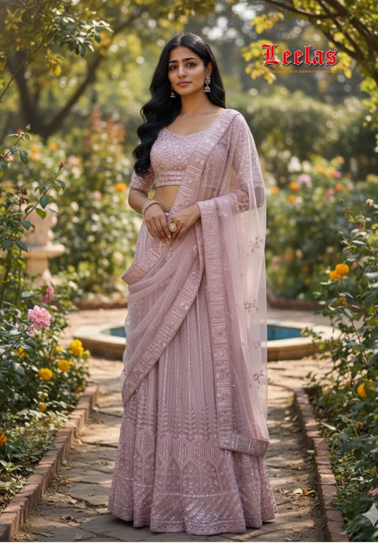 Light pink net/satin  stonework and sequins lengha with blouse piece